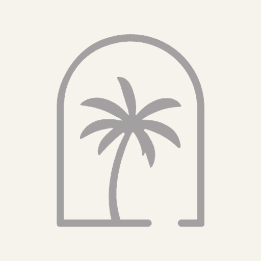 Official Caribe Guest Experience palm and arch symbol
